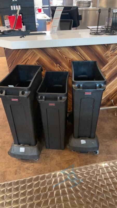 3 RubberMaid trash cans with 2 dollies