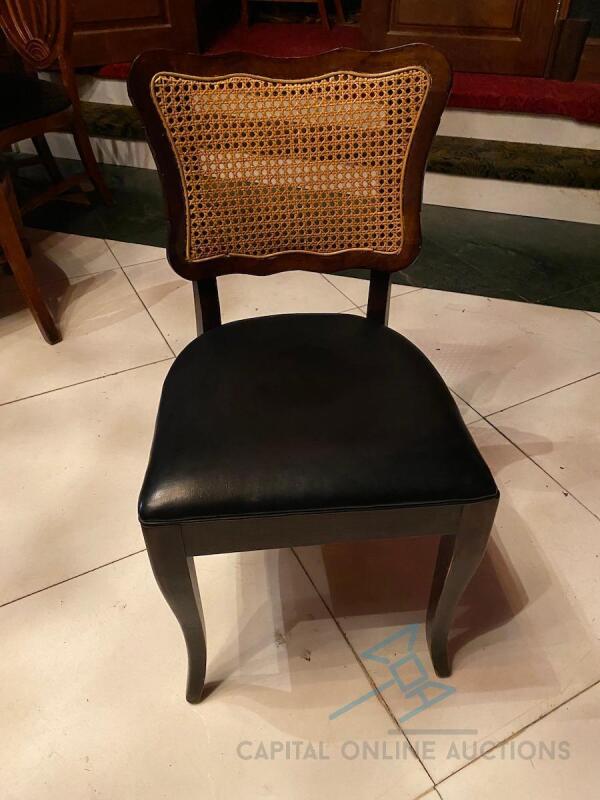 19 Solid wood framed chair with black vinyl seat and straw back
