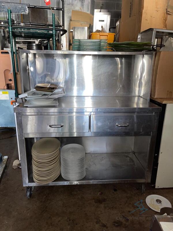 Stainless Steel Table with under and over shelf on wheels