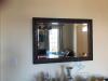 black embossed wood framed black mirror