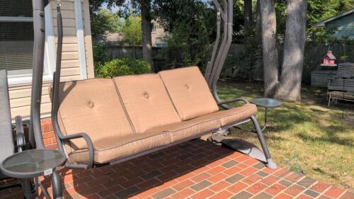 Glider with cushions, two small tables attached