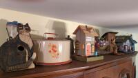 Top Shelf of China Hutch, bird houses, cake tin, fruit bowl...