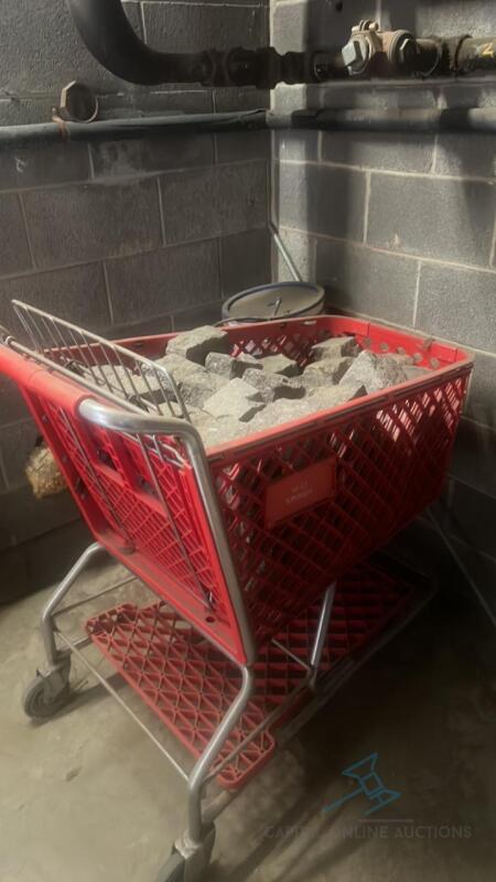 Contents of storage including rocks, cart , handicap sign