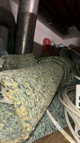 Lot of approx 30 carpet remnants and rolls of padding