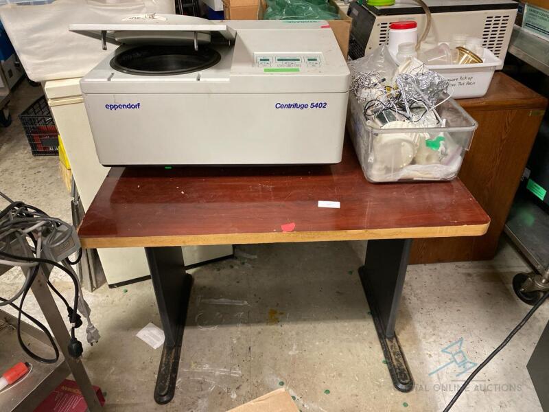 Eppendorf Centrifuge on table with miscellaneous parts