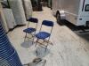 100 blue and tan Samsonite folding chairs.