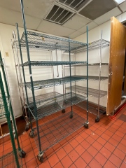 Green shelving unit on wheels