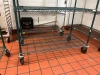 Green shelving unit on wheels - 2