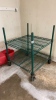 Green shelving unit on wheels