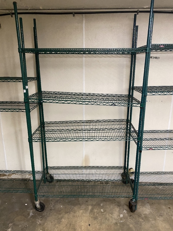 Green shelving unit on wheels