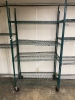 Green shelving unit on wheels