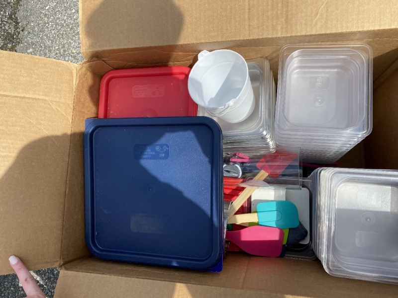 Assorted kitchen utensils and food storage bins